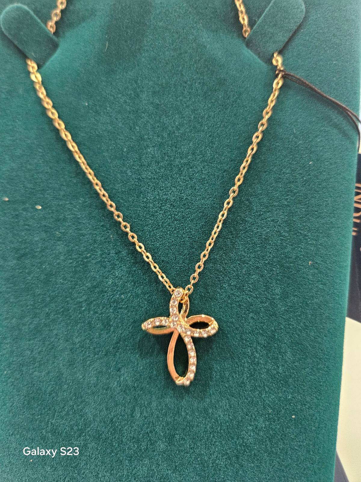 Goldplated cross with clear stones