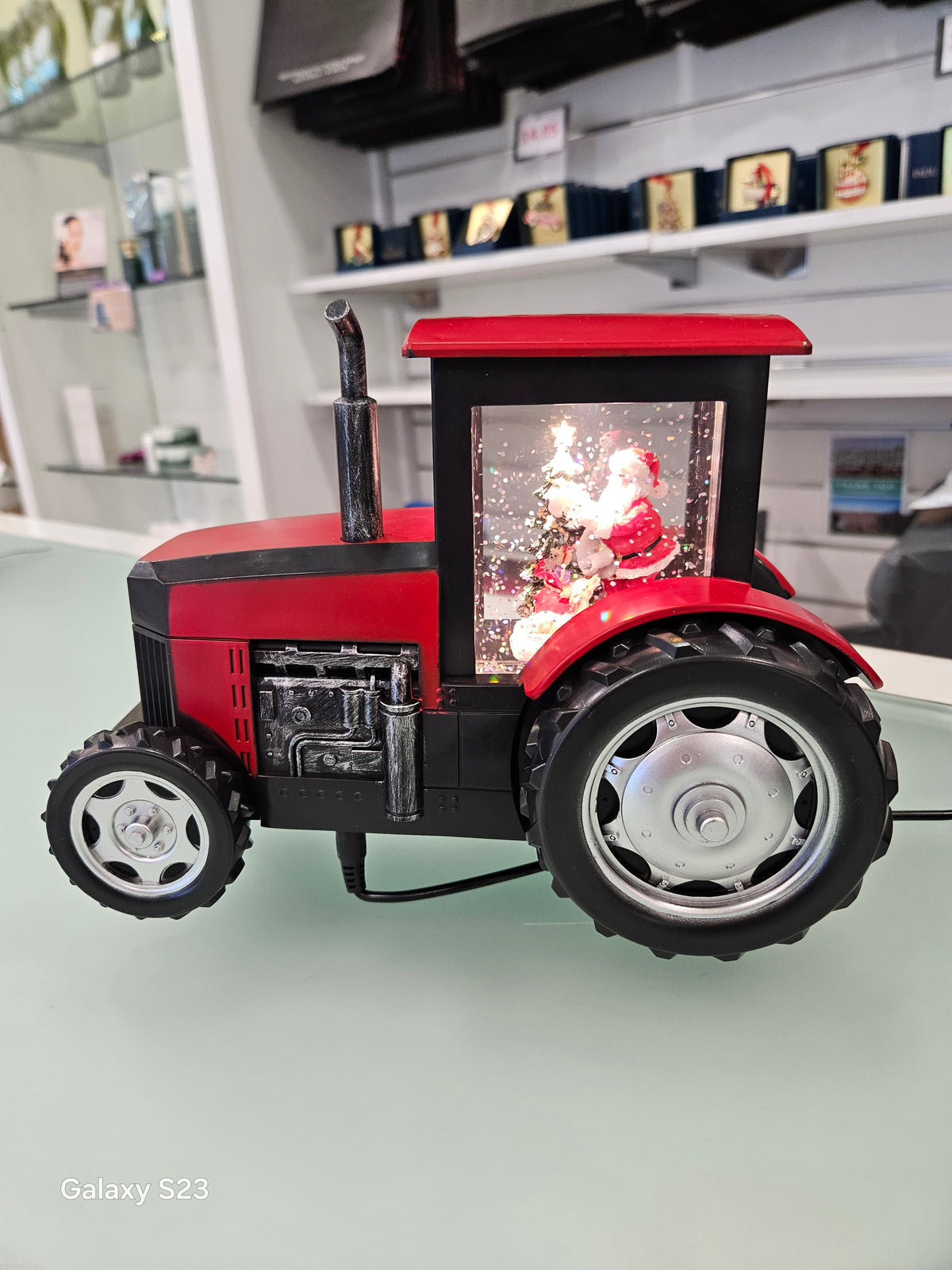 Tractor Santa Snow Globe Red