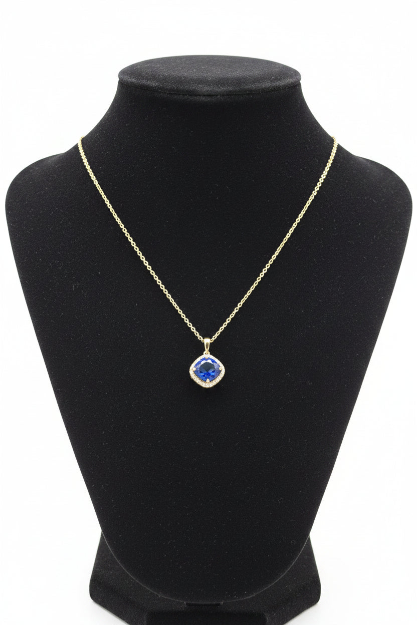 Silver pendant with a blue stone & clear stones