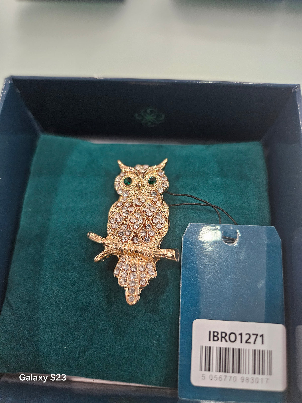 Gold owl with Emerald eyes