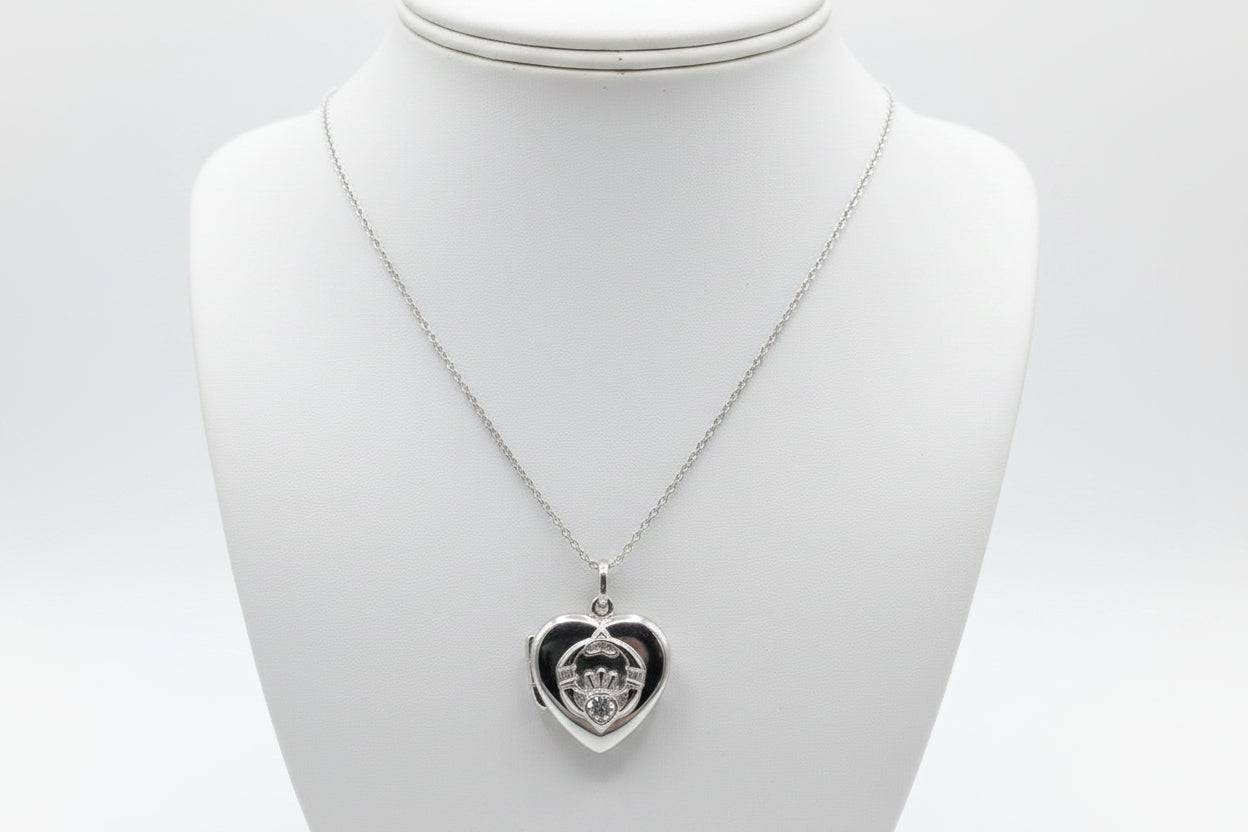 Silver claddagh locket with clear stone