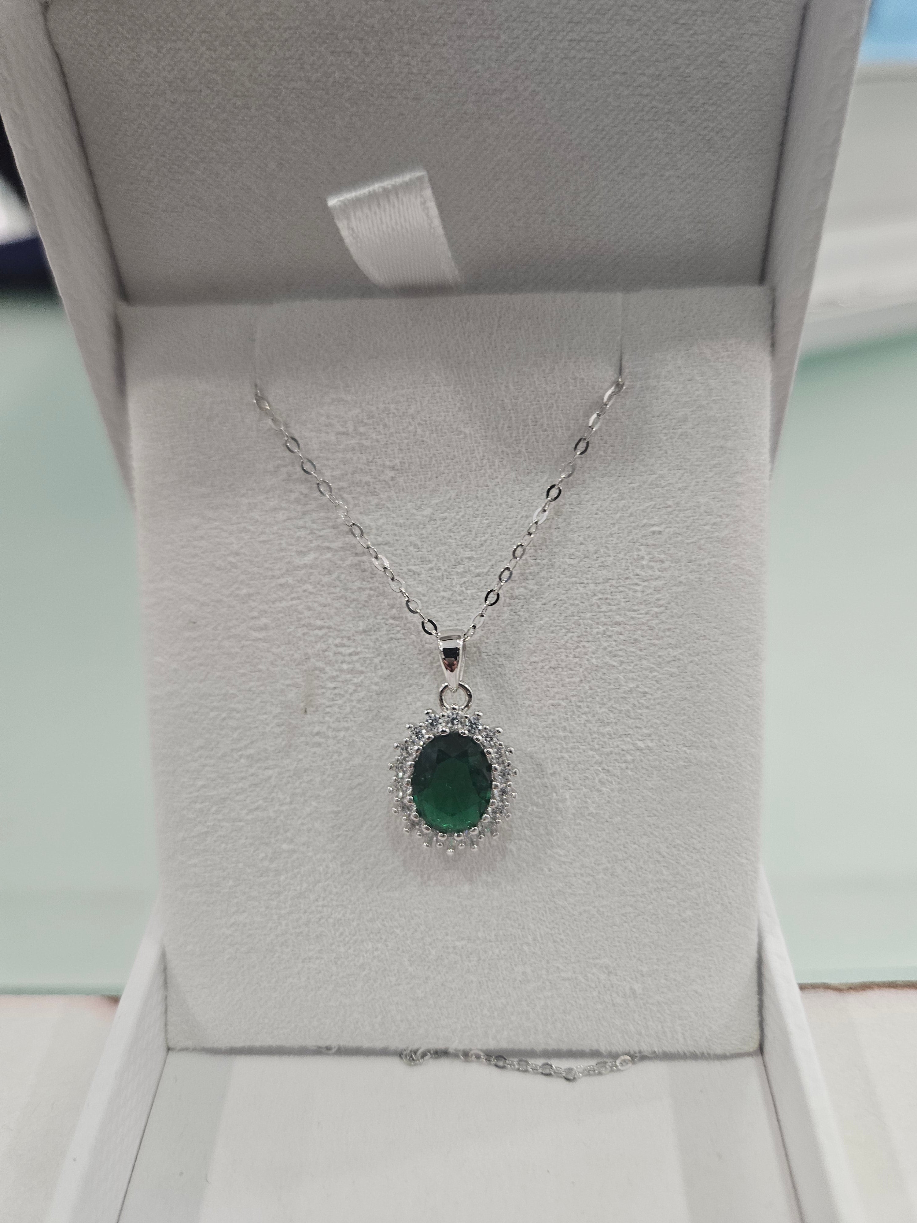 Silver pendant with green stone