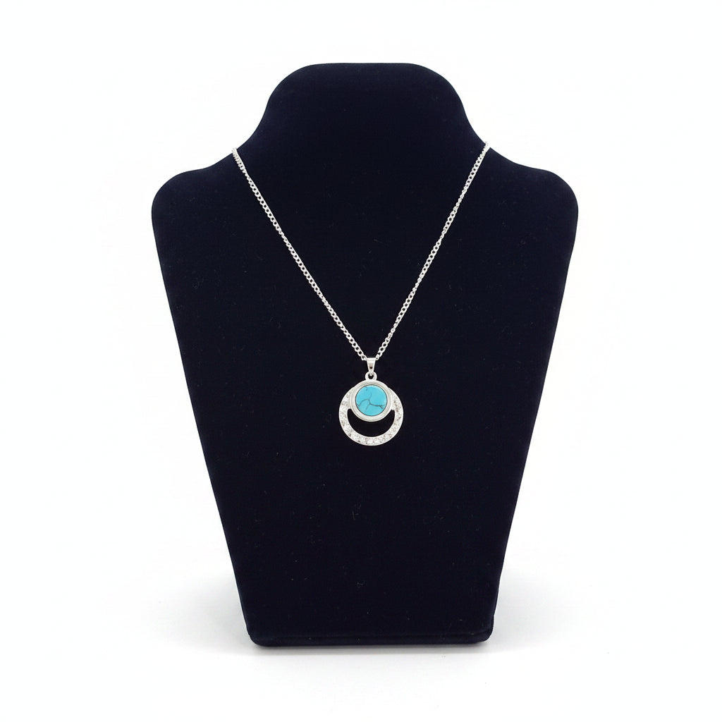 Silver pendant with blue stone