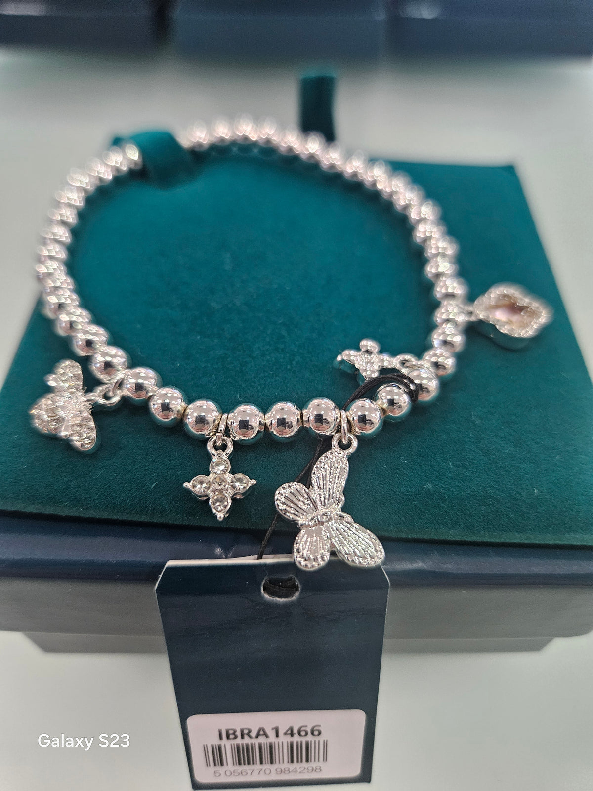 Silverplated charm stretch beed braclet
