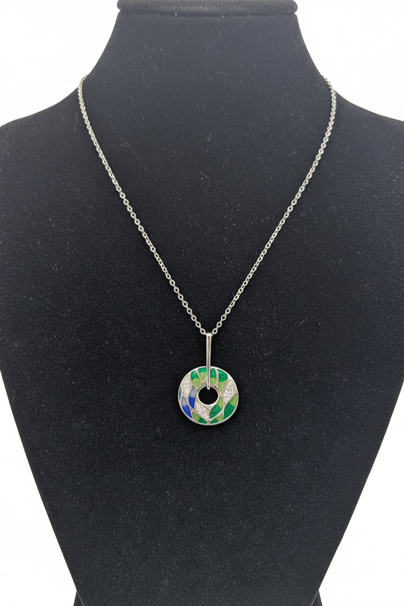 Silverplated  disk with blue,green & clear stones